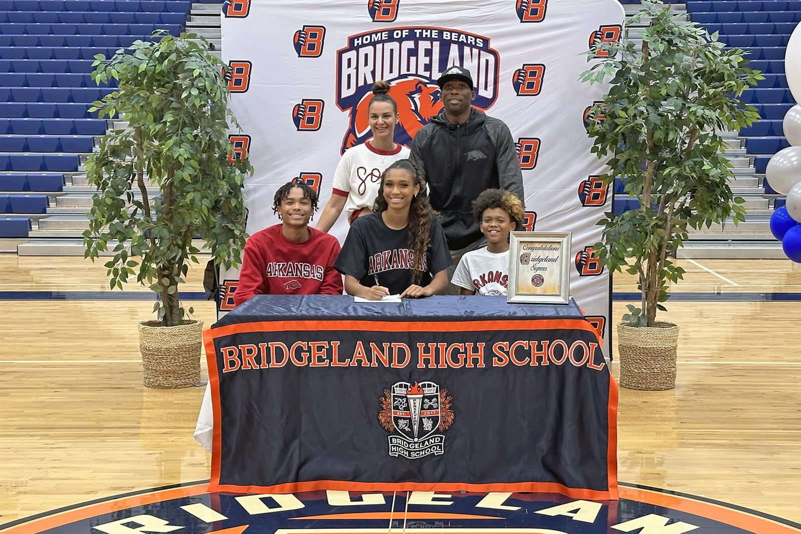 Bridgeland senior Anaiyah Robinson, seated center, signed a letter of intent to play soccer at the University of Arkansas.